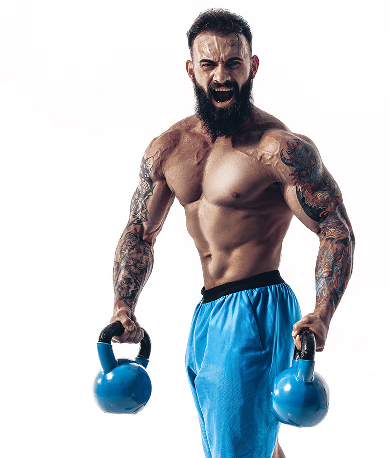 Muscular shirtless tattooed bearded male athlete bodybuilder wor